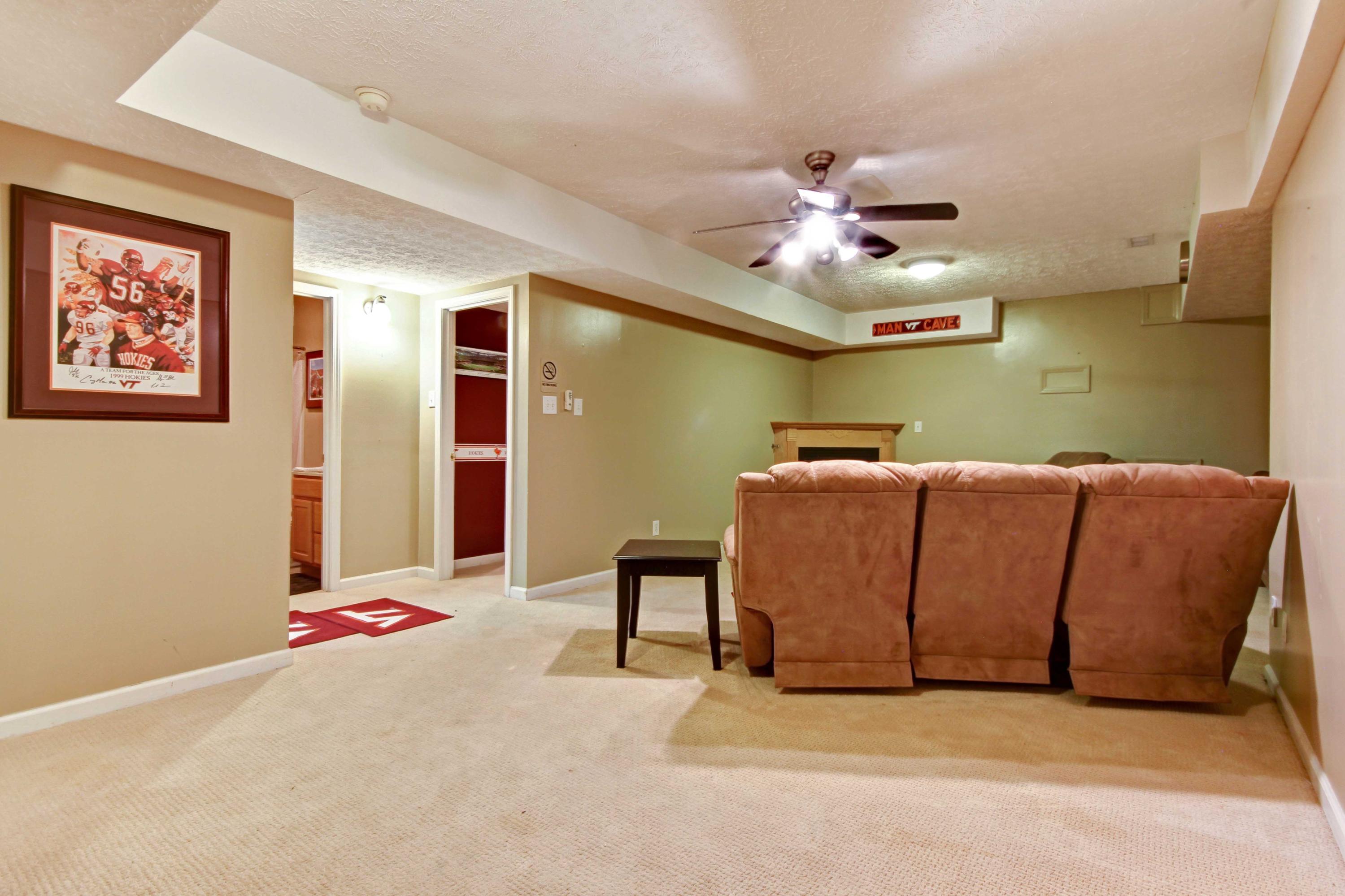 4690 Crosier Road Elliston, VA 24087 - Photo 47 of 79 a room with a bed and a chandelier