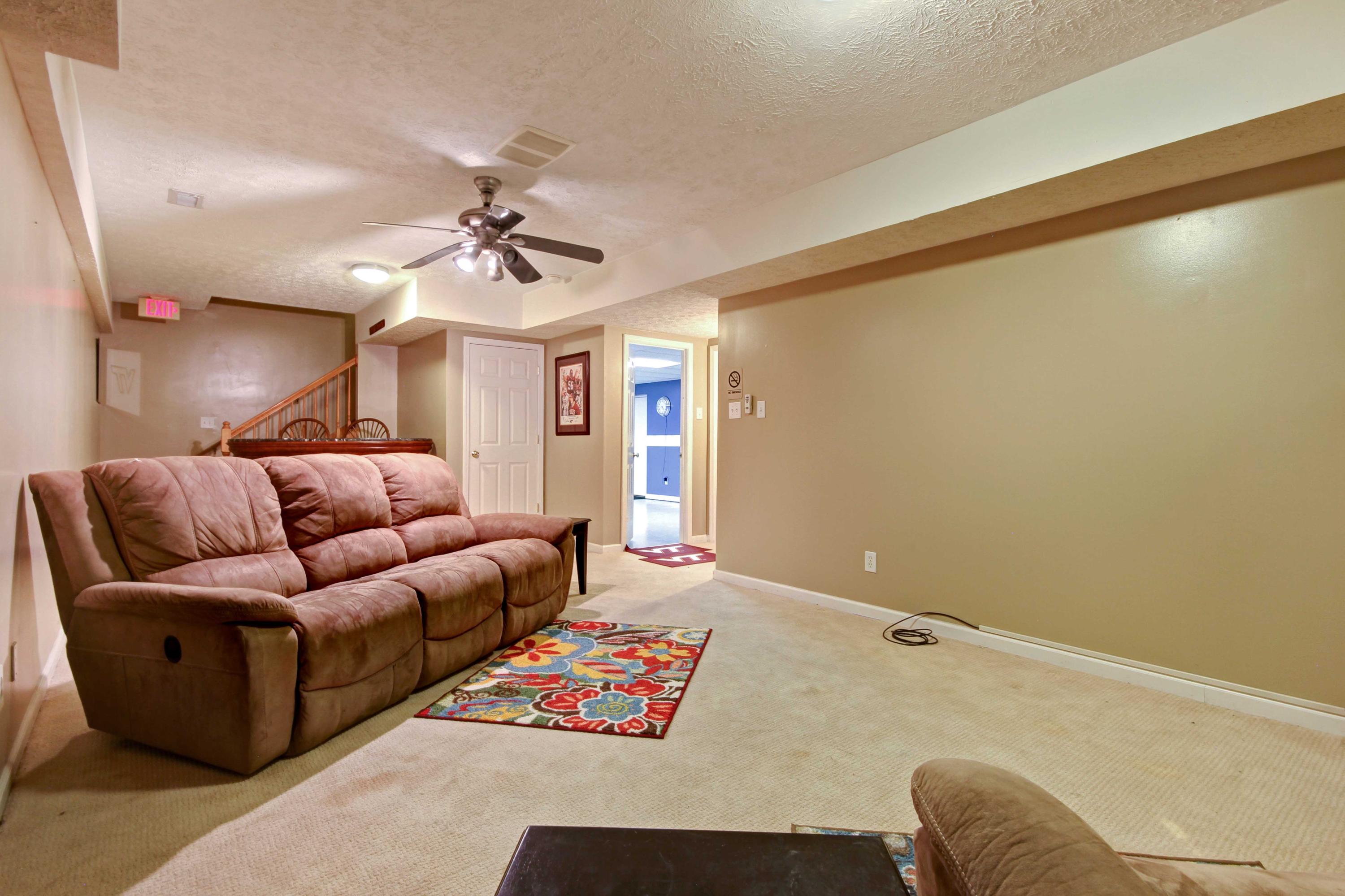4690 Crosier Road Elliston, VA 24087 - Photo 50 of 79 a living room with furniture and a ceiling fan