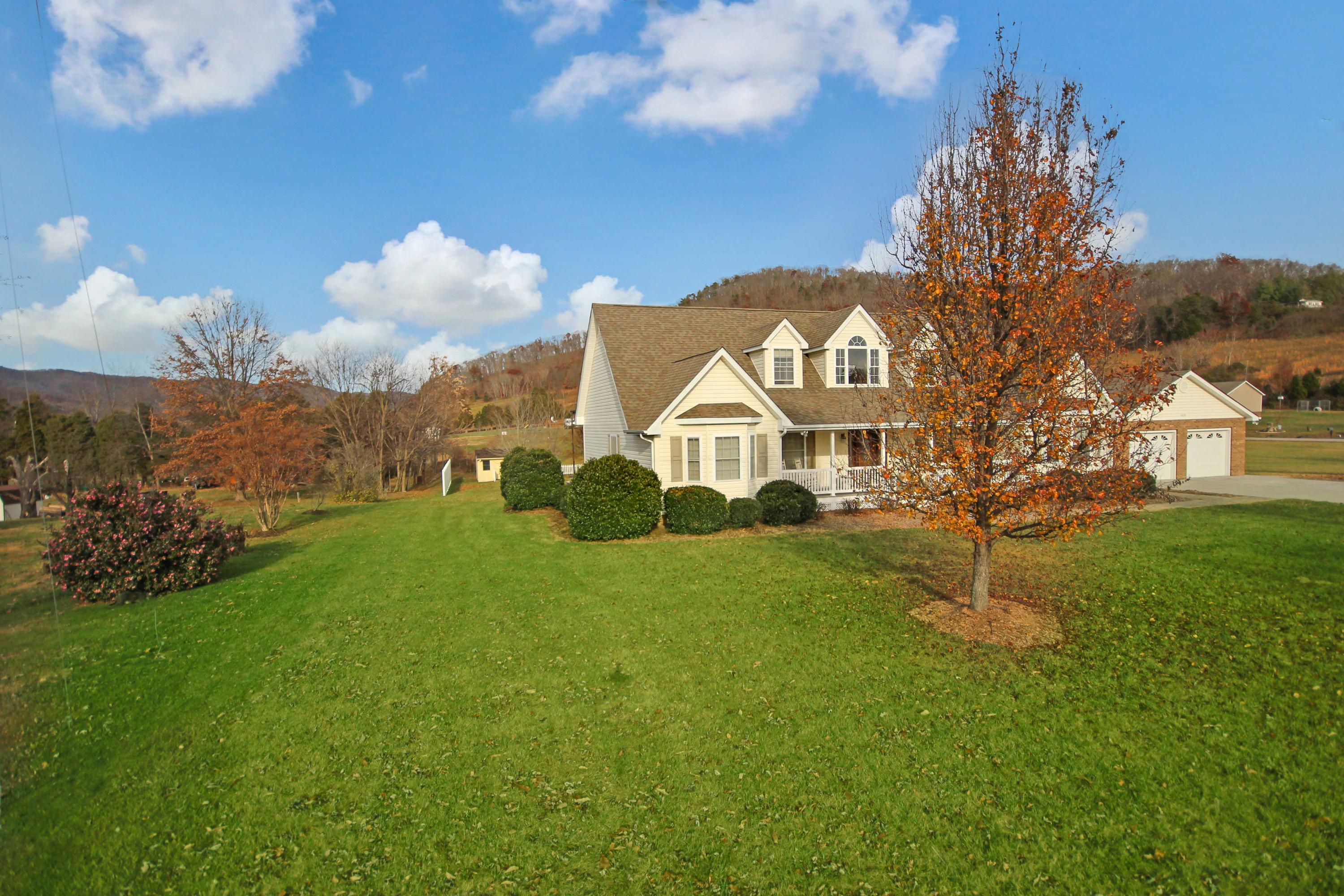 4690 Crosier Road Elliston, VA 24087 - Photo 6 of 79 a front view of a house with garden