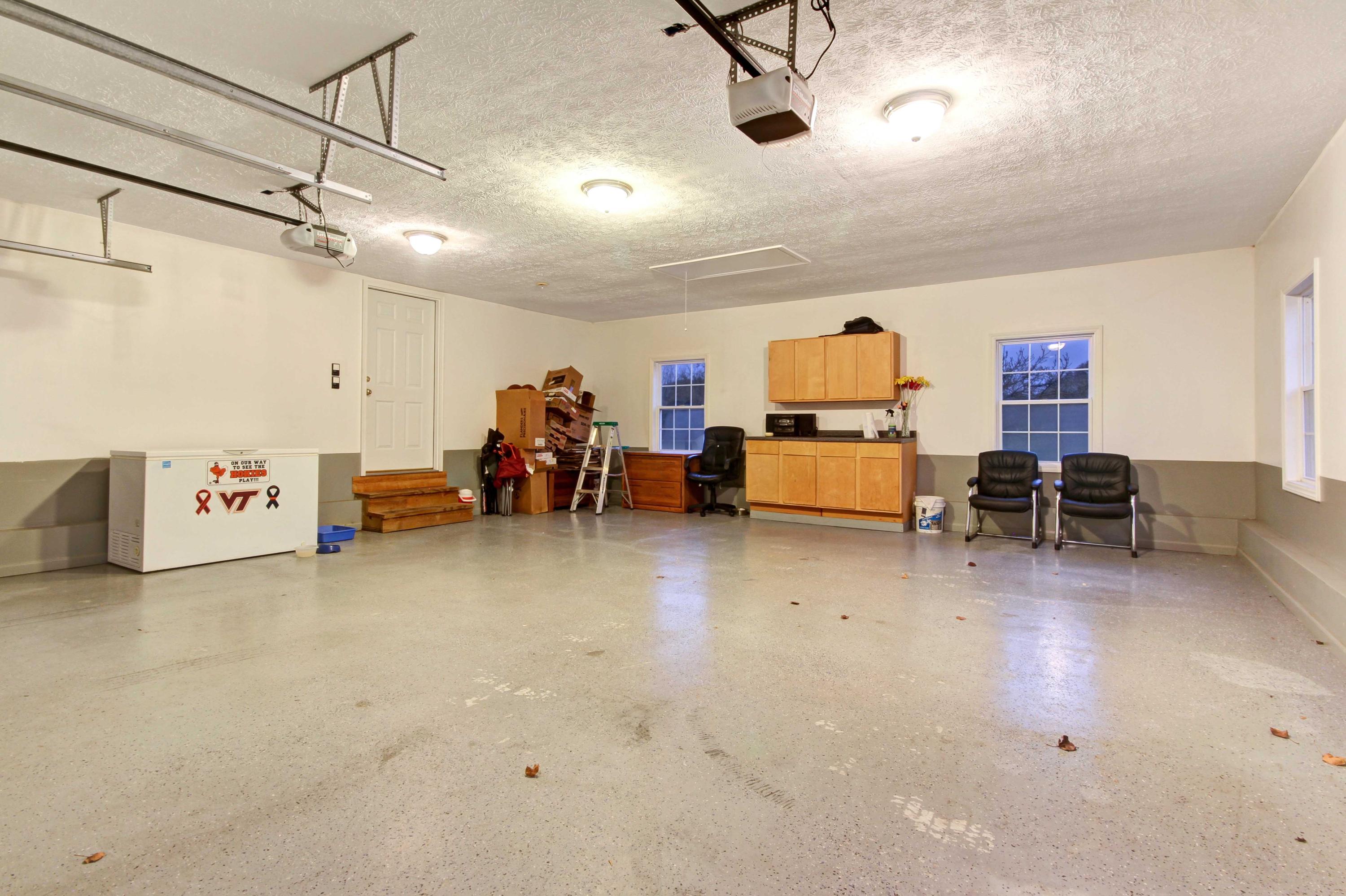4690 Crosier Road Elliston, VA 24087 - Photo 58 of 79 a living room with furniture and a chandelier