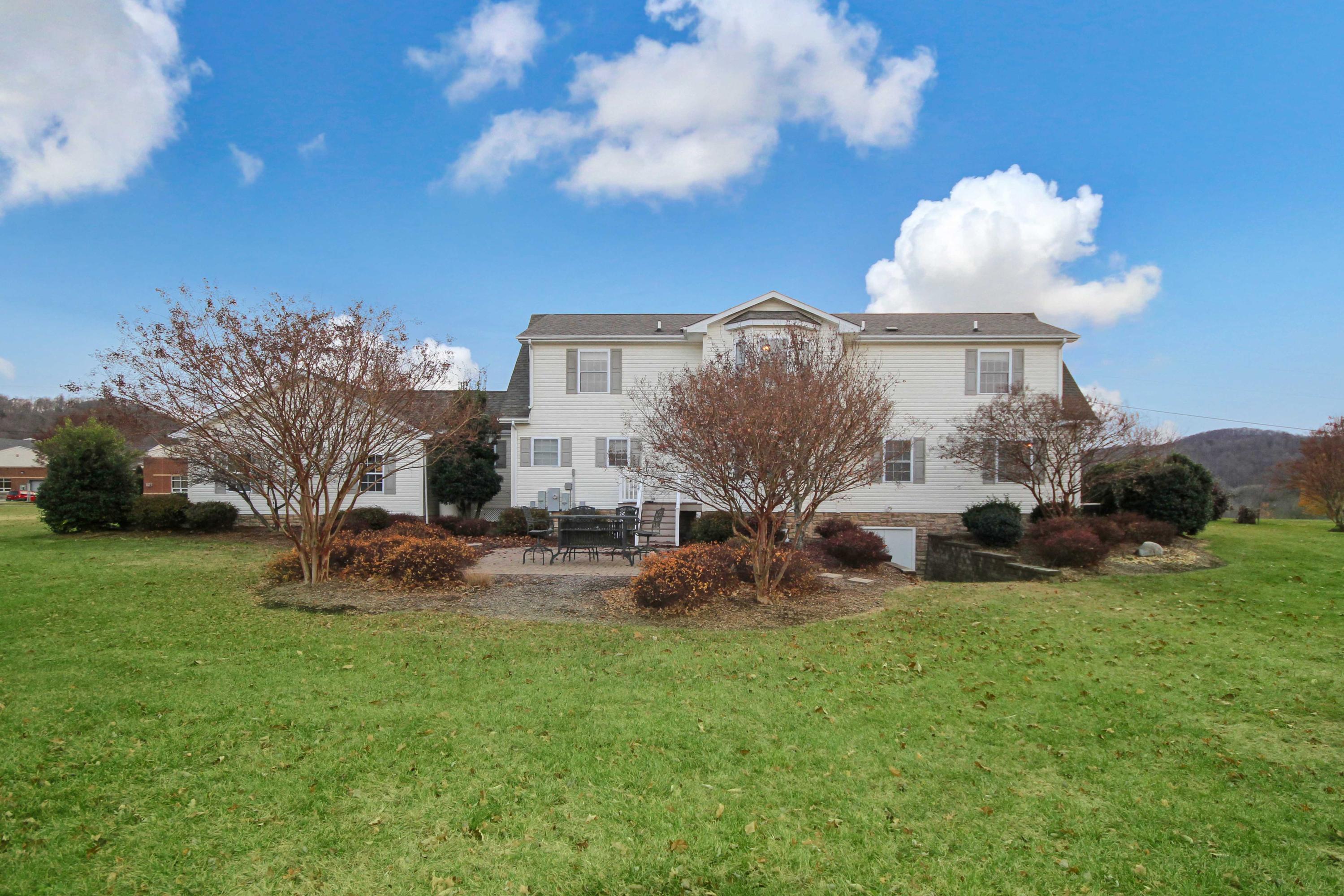 4690 Crosier Road Elliston, VA 24087 - Photo 74 of 79 a view of a house with a yard and sitting area