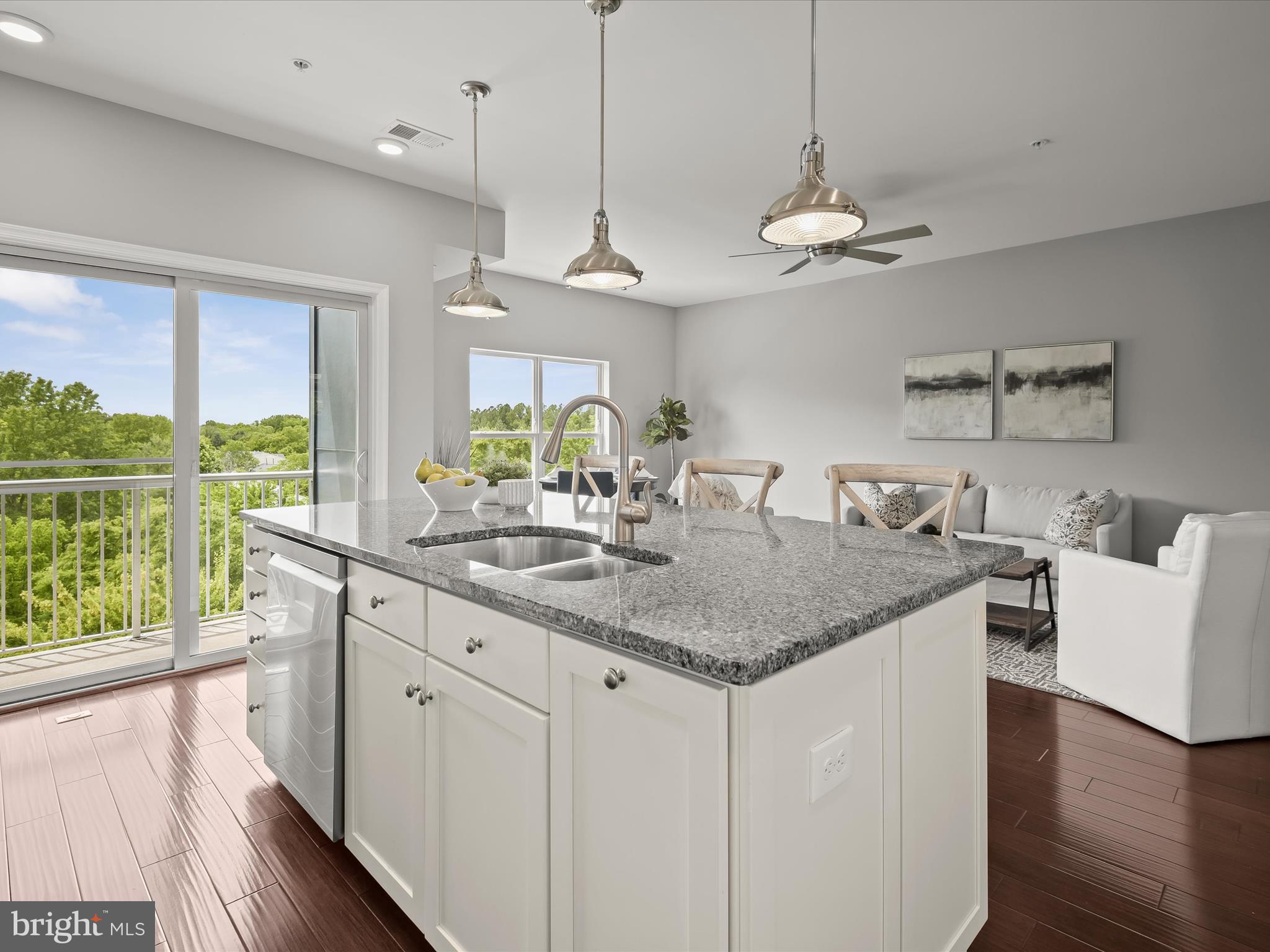 179 Copley Circle, Unit 30B Gaithersburg, MD 20878 - Photo 18 of 41 a view of a kitchen island a sink and wooden floor
