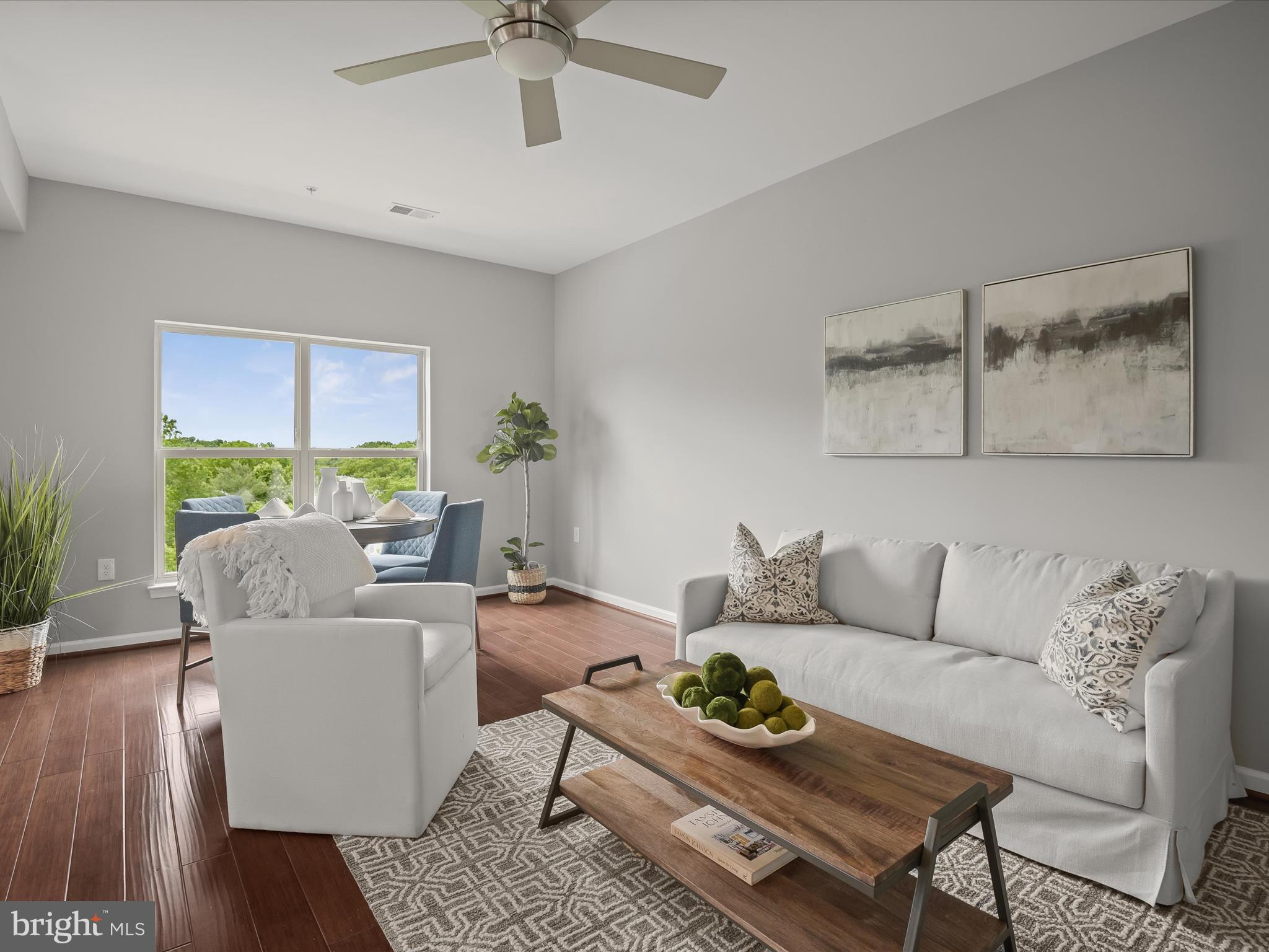 179 Copley Circle, Unit 30B Gaithersburg, MD 20878 - Photo 20 of 41 a living room with furniture and a window