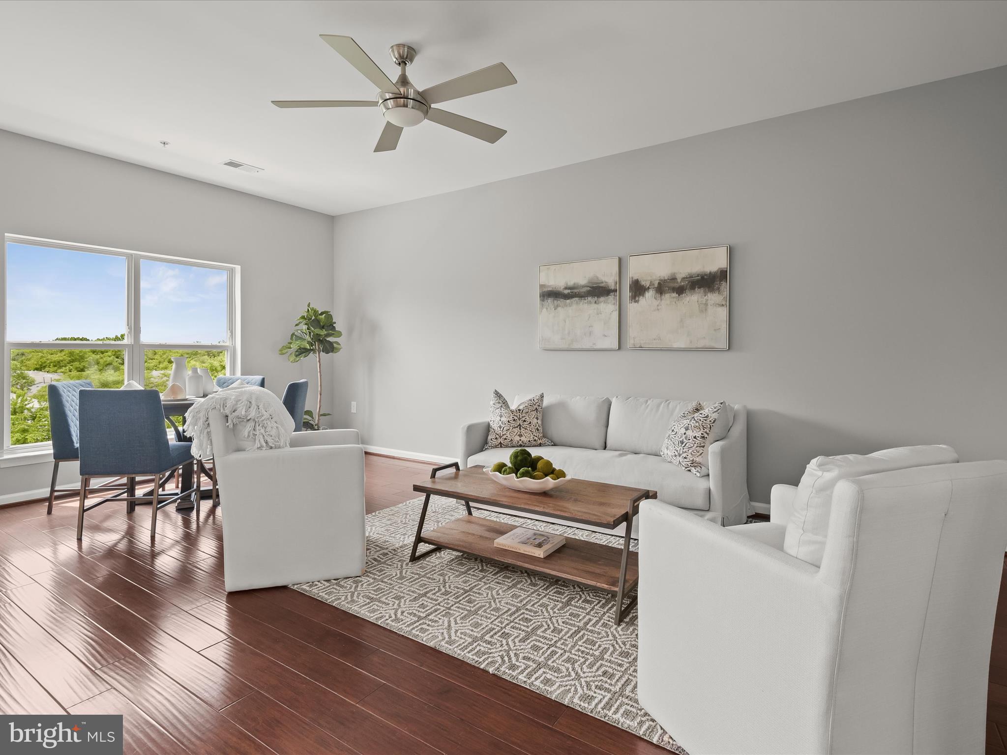 179 Copley Circle, Unit 30B Gaithersburg, MD 20878 - Photo 23 of 41 a living room with furniture and a wooden floor