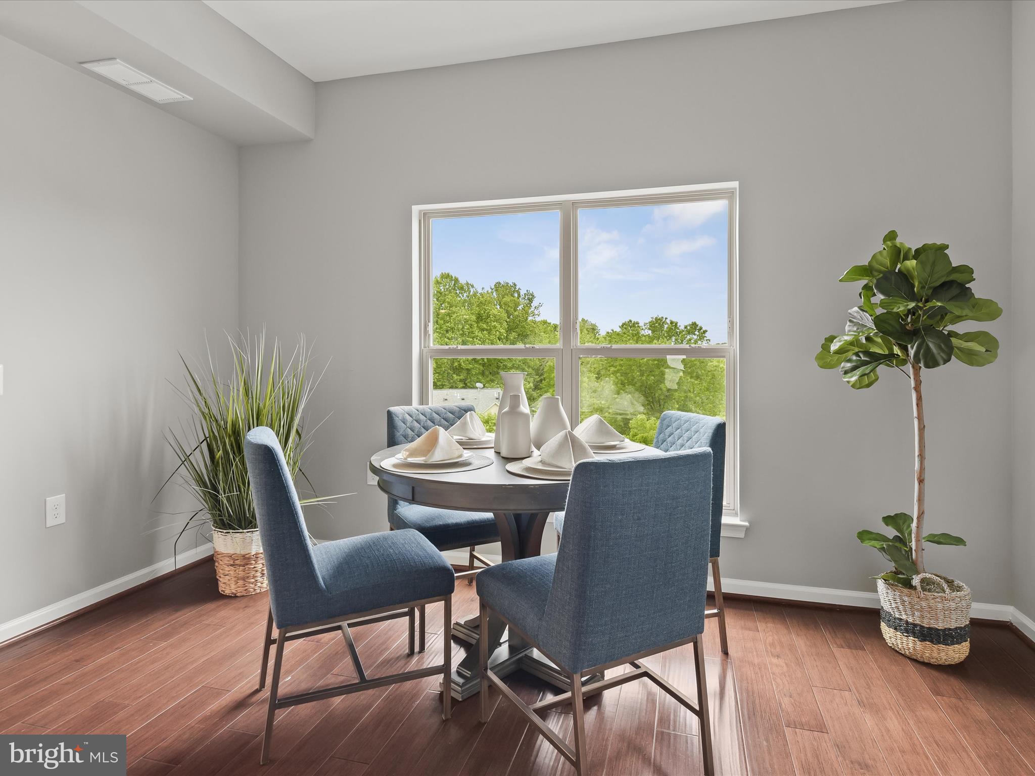 179 Copley Circle, Unit 30B Gaithersburg, MD 20878 - Photo 24 of 41 a dining room with furniture window and wooden floor