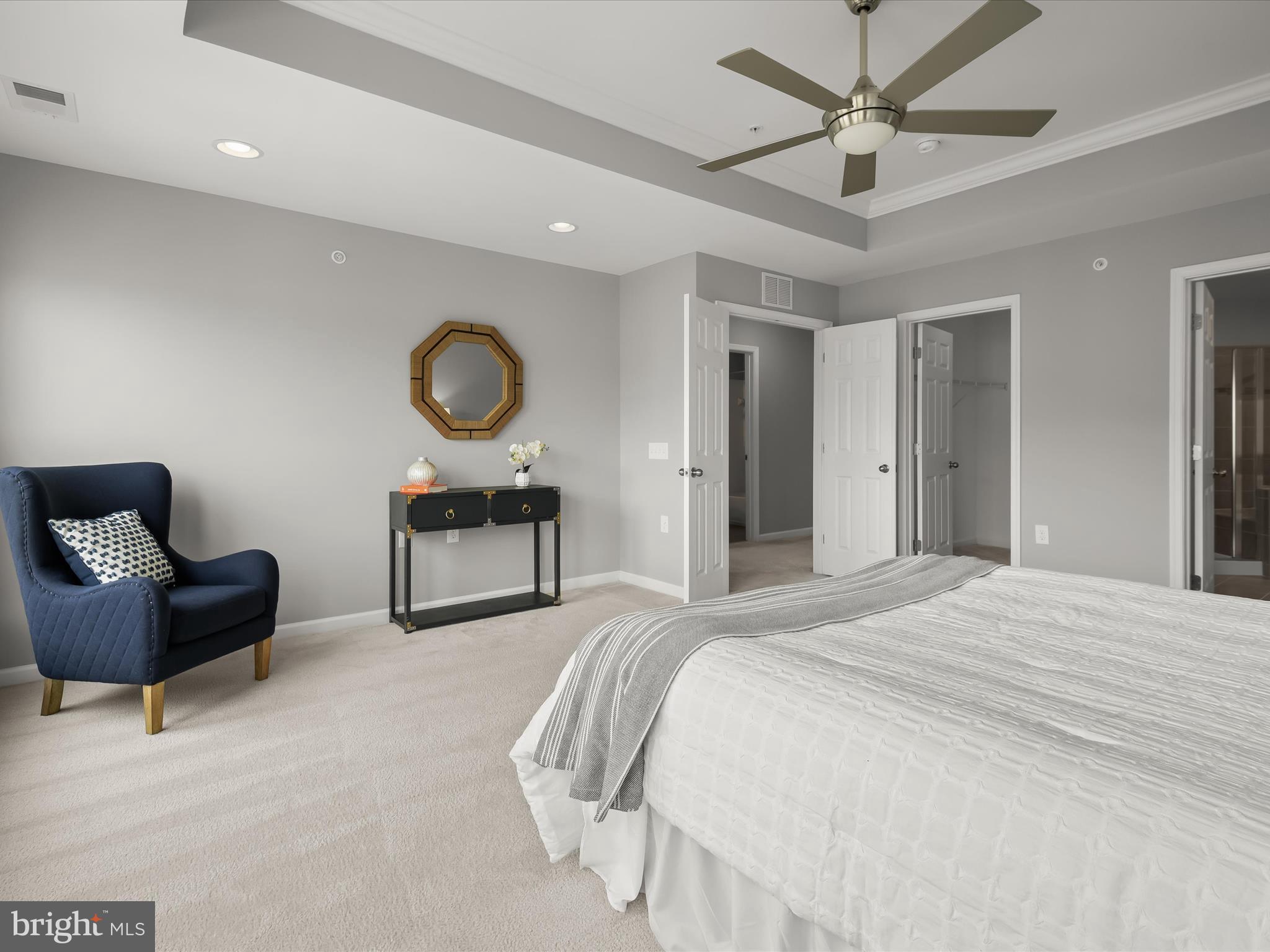 179 Copley Circle, Unit 30B Gaithersburg, MD 20878 - Photo 30 of 41 a bedroom with a bed and a chair