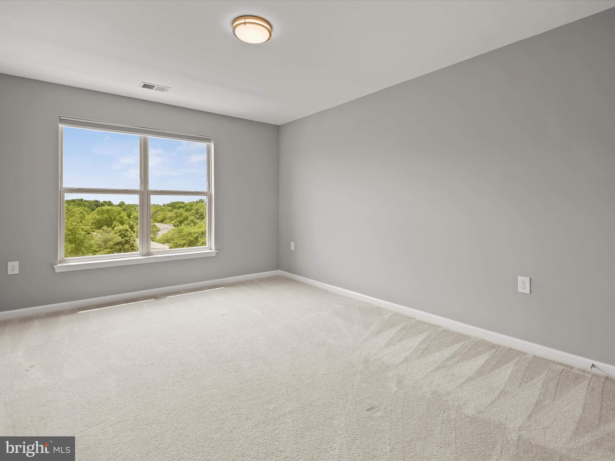 179 Copley Circle, Unit 30B Gaithersburg, MD 20878 - Photo 34 of 41 an empty room with a window