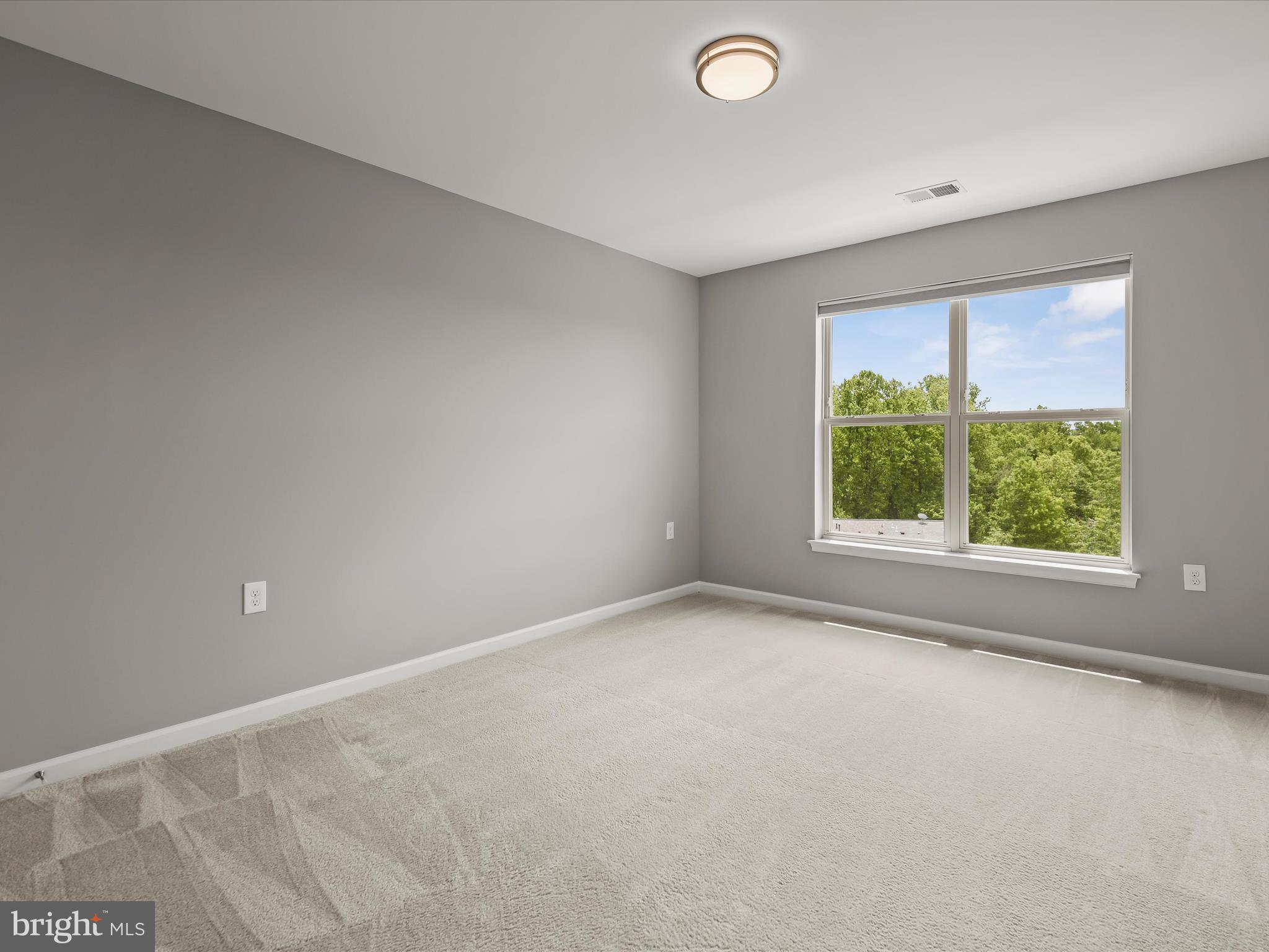 179 Copley Circle, Unit 30B Gaithersburg, MD 20878 - Photo 35 of 41 an empty room with a window