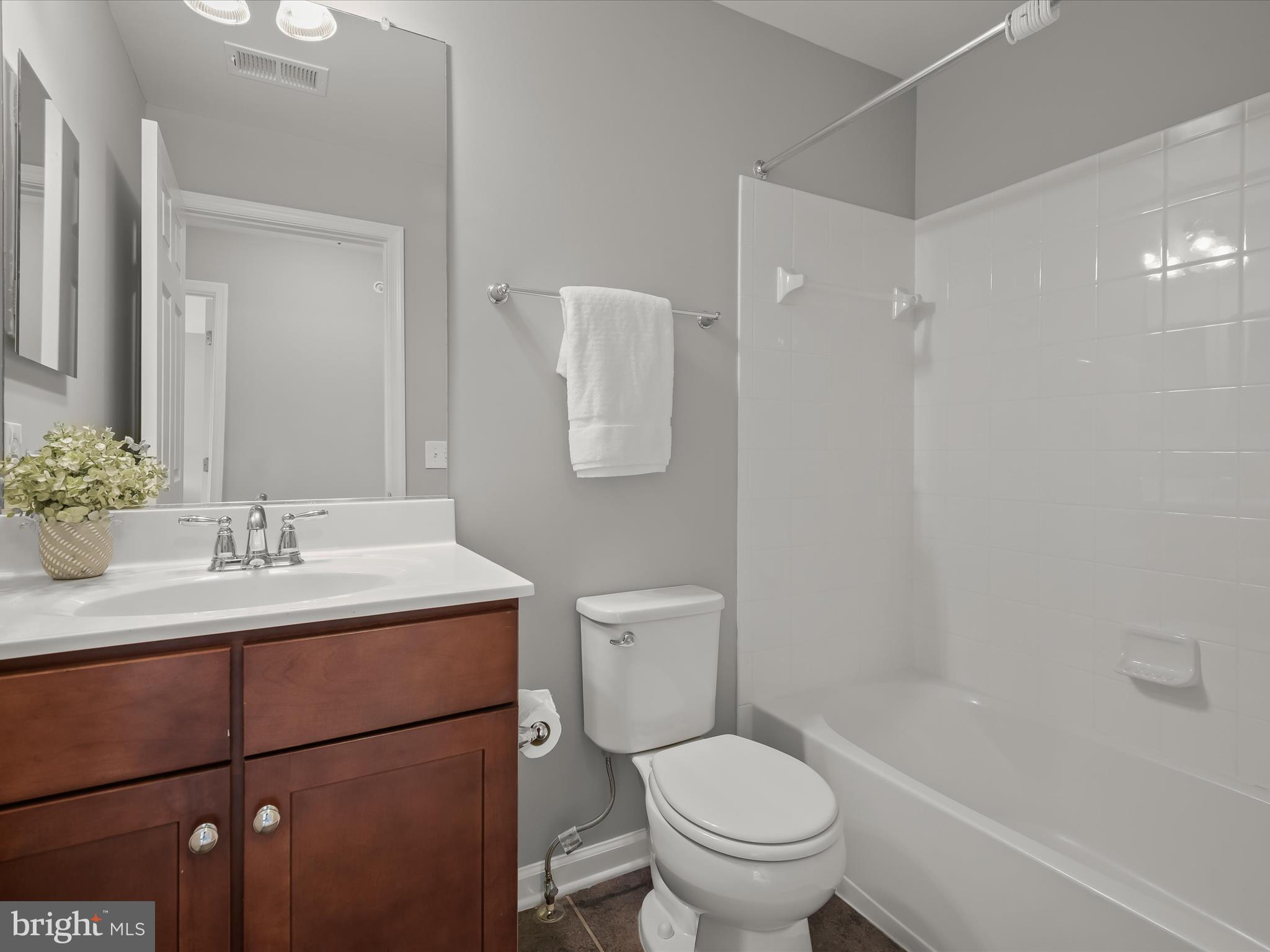179 Copley Circle, Unit 30B Gaithersburg, MD 20878 - Photo 36 of 41 a bathroom with a sink toilet and shower