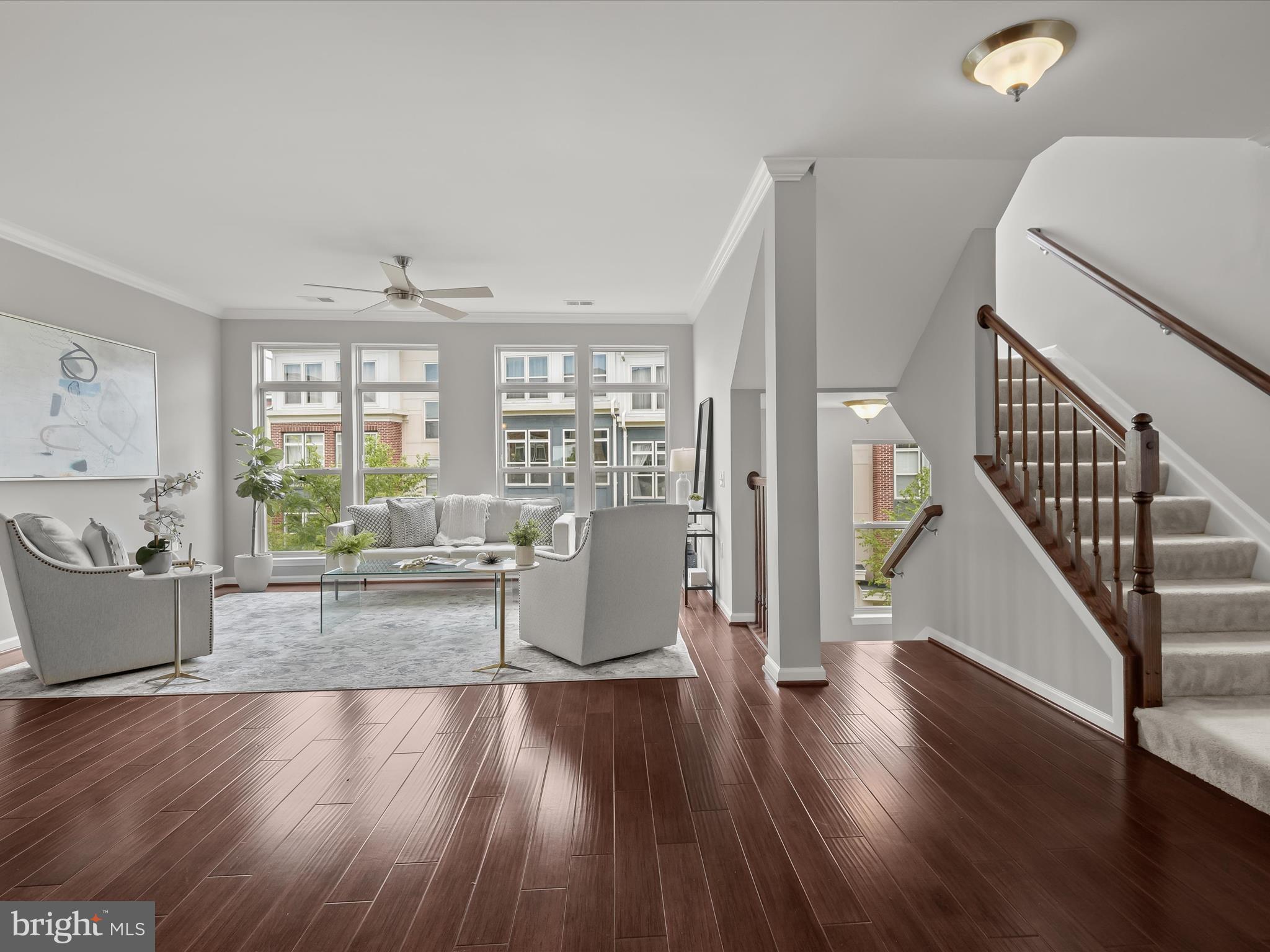 179 Copley Circle, Unit 30B Gaithersburg, MD 20878 - Photo 5 of 41 a living room with furniture and a wooden floor