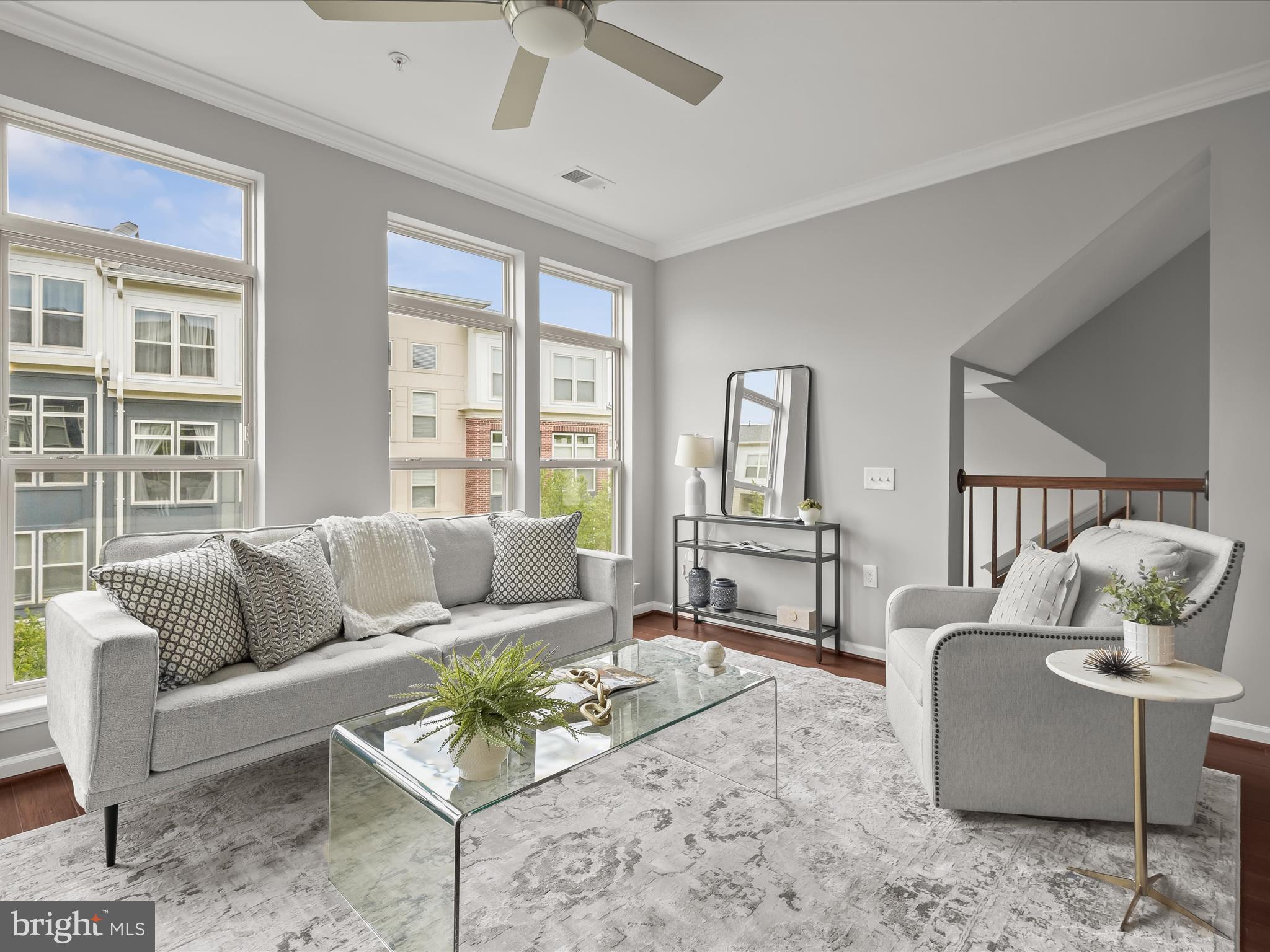 179 Copley Circle, Unit 30B Gaithersburg, MD 20878 - Photo 7 of 41 a living room with furniture and a large window