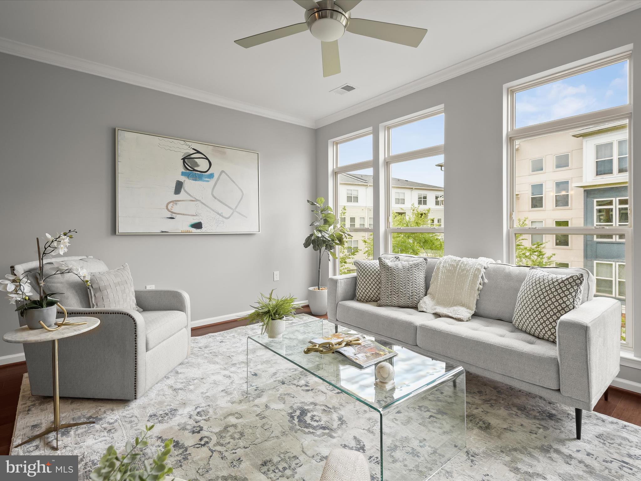 179 Copley Circle, Unit 30B Gaithersburg, MD 20878 - Photo 8 of 41 a living room with furniture and a large window