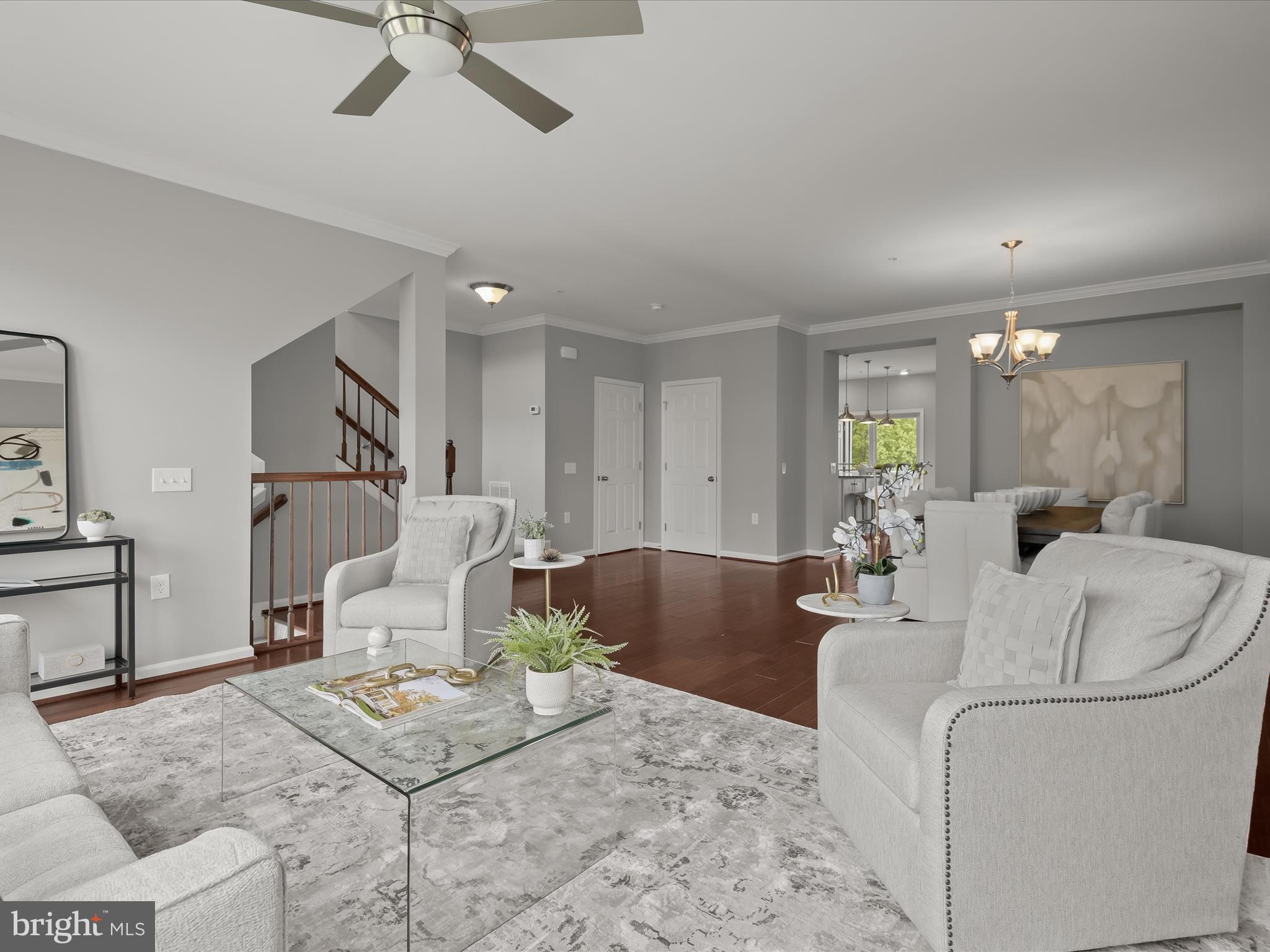 179 Copley Circle, Unit 30B Gaithersburg, MD 20878 - Photo 9 of 41 a living room with furniture and a table