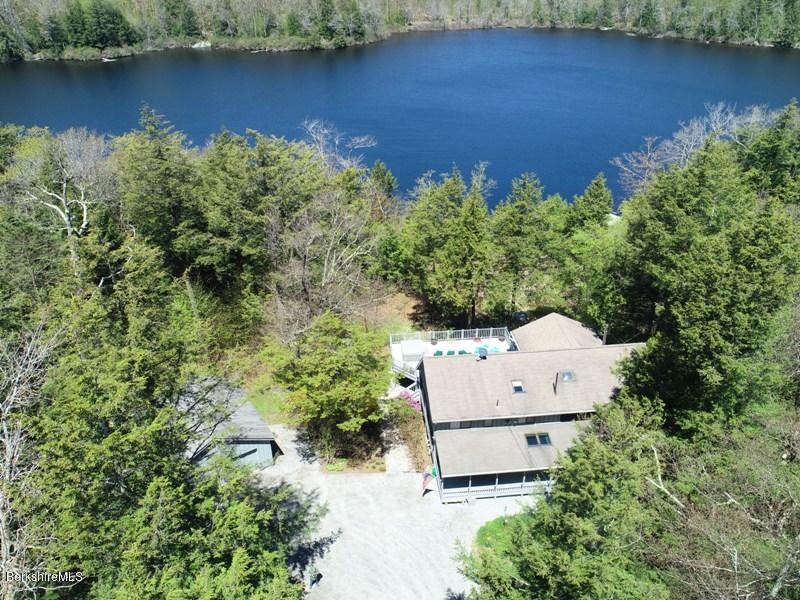 57 Hayes Pond Road Otis, MA 01253 - Photo 2 of 36 an aerial view of a house with a yard and lake view