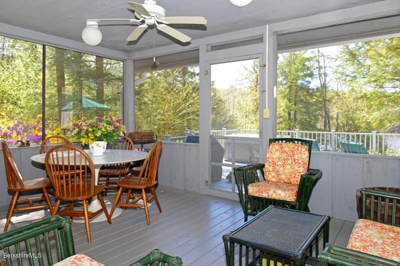 57 Hayes Pond Road Otis, MA 01253 - Photo 11 of 36 a view of a dining room with furniture window and outside view