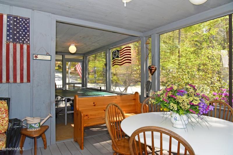 57 Hayes Pond Road Otis, MA 01253 - Photo 12 of 36 a view of a dining room with furniture window and outside view