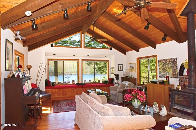 57 Hayes Pond Road Otis, MA 01253 - Photo 13 of 36 a living room with furniture and a large window