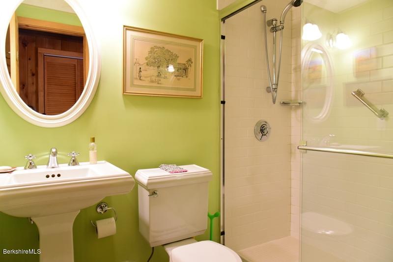 57 Hayes Pond Road Otis, MA 01253 - Photo 21 of 36 a bathroom with a sink mirror and toilet
