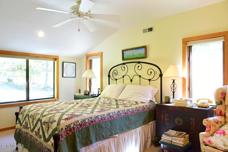 57 Hayes Pond Road Otis, MA 01253 - Photo 22 of 36 a bedroom with a bed and a window