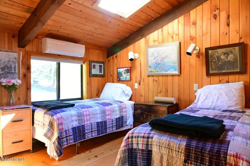 57 Hayes Pond Road Otis, MA 01253 - Photo 26 of 36 a bedroom with two beds and a window