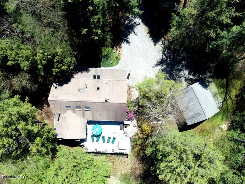 57 Hayes Pond Road Otis, MA 01253 - Photo 4 of 36 an aerial view of a house with a yard and trees