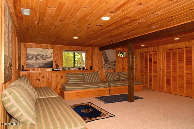 57 Hayes Pond Road Otis, MA 01253 - Photo 32 of 36 a view of an empty room with wooden floor