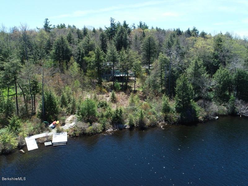 57 Hayes Pond Road Otis, MA 01253 - Photo 5 of 36 an aerial view of a house with a yard swimming pool and outdoor seating