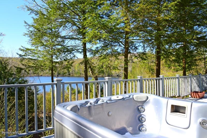 57 Hayes Pond Road Otis, MA 01253 - Photo 8 of 36 a view of a patio with a table and chairs