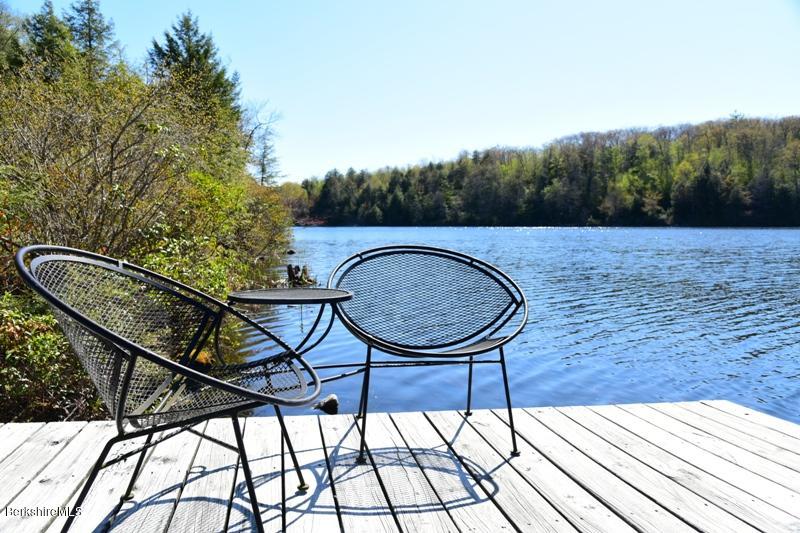 57 Hayes Pond Road Otis, MA 01253 - Photo 10 of 36 a view of a couches in the balcony
