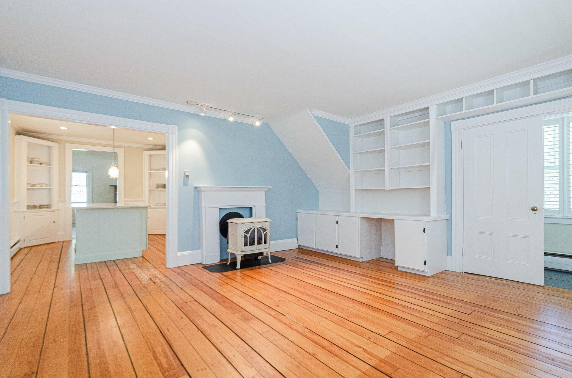 1089 Main Street Cotuit, MA 02635 - Photo 9 of 41 a bedroom with a bed and wooden floor