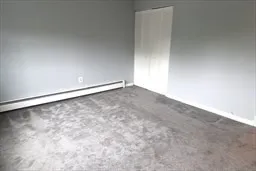 a view of backyard with barbeque grill and outdoor seating