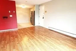 a view of a kitchen from the hallway