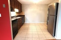 a kitchen with a refrigerator and a refrigerator