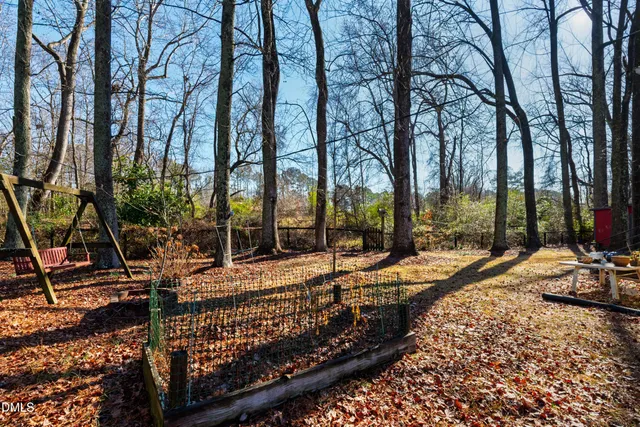 a view of a park with trees and sitting area