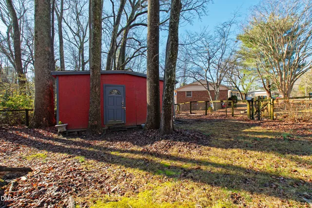 a view of a house with a yard covered with snow