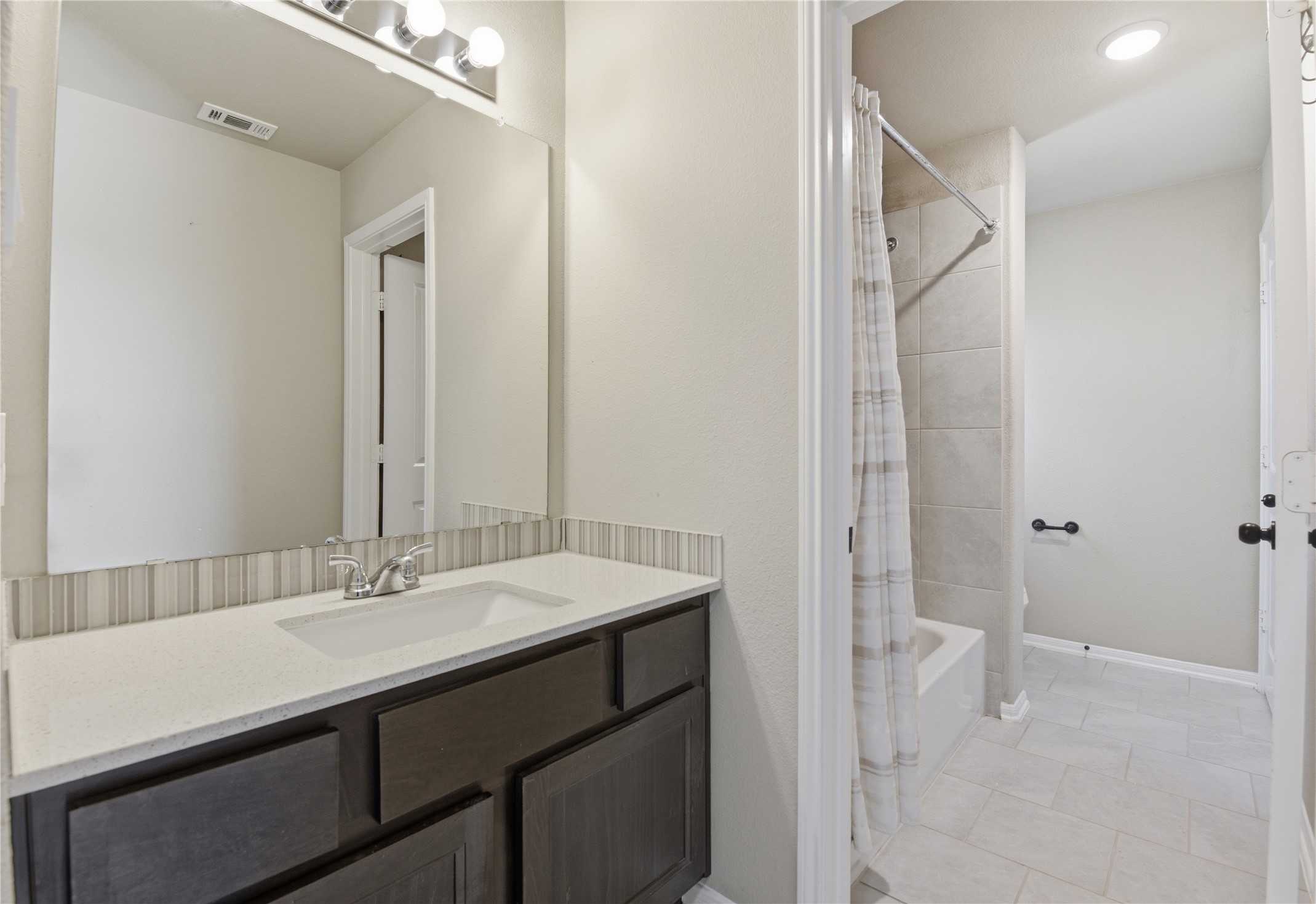 17501 Spice Merlot Lane Conroe, TX 77302 - Photo 44 of 50 a bathroom with a sink and a mirror