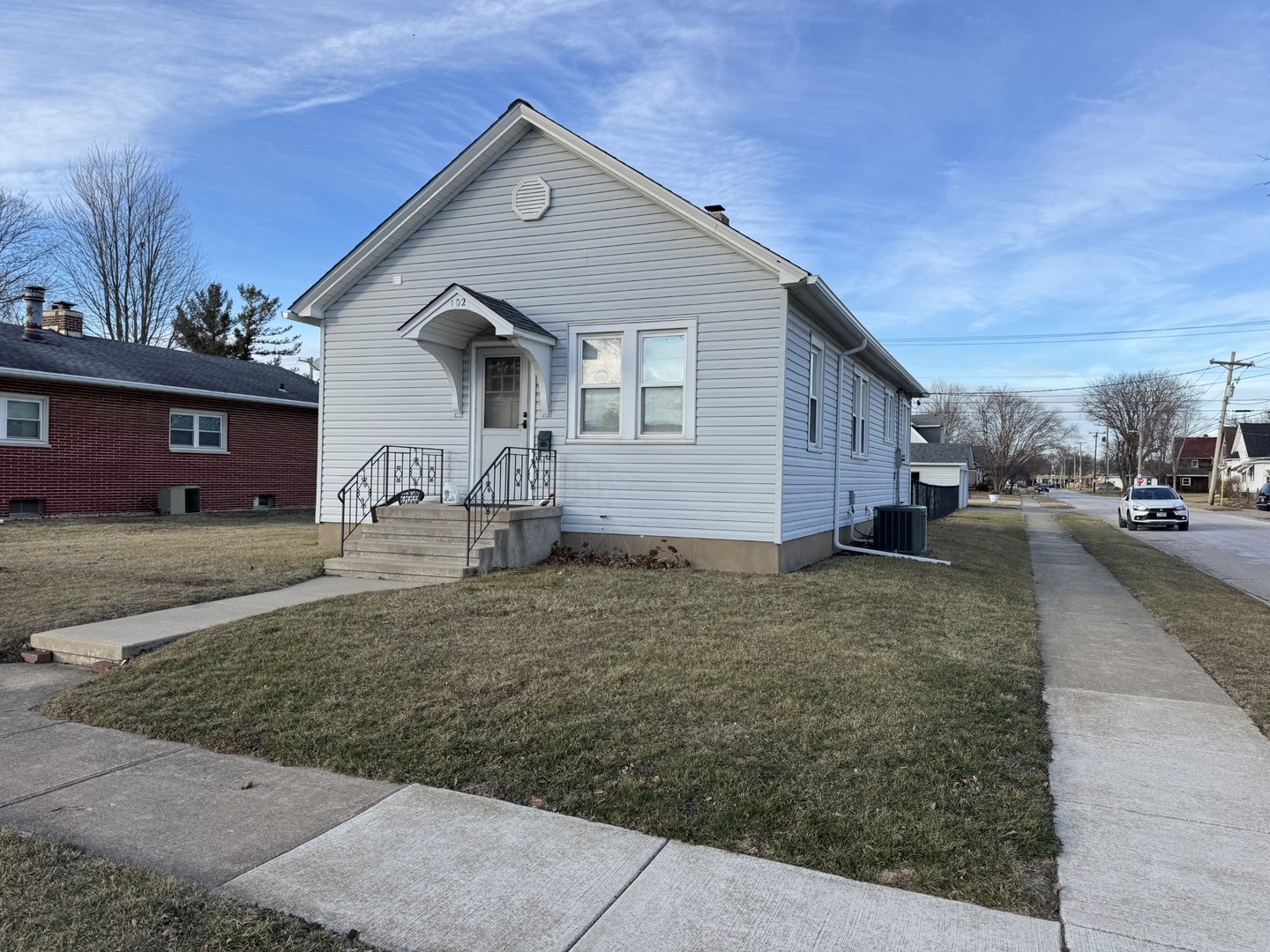 102 West 3rd Street Oglesby, IL 61348 - Photo 1 of 12 a front view of a house with a yard