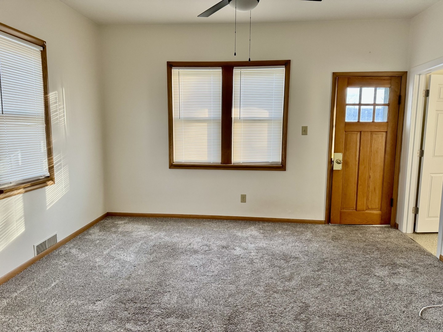 102 West 3rd Street Oglesby, IL 61348 - Photo 5 of 12 an empty room with windows and closet