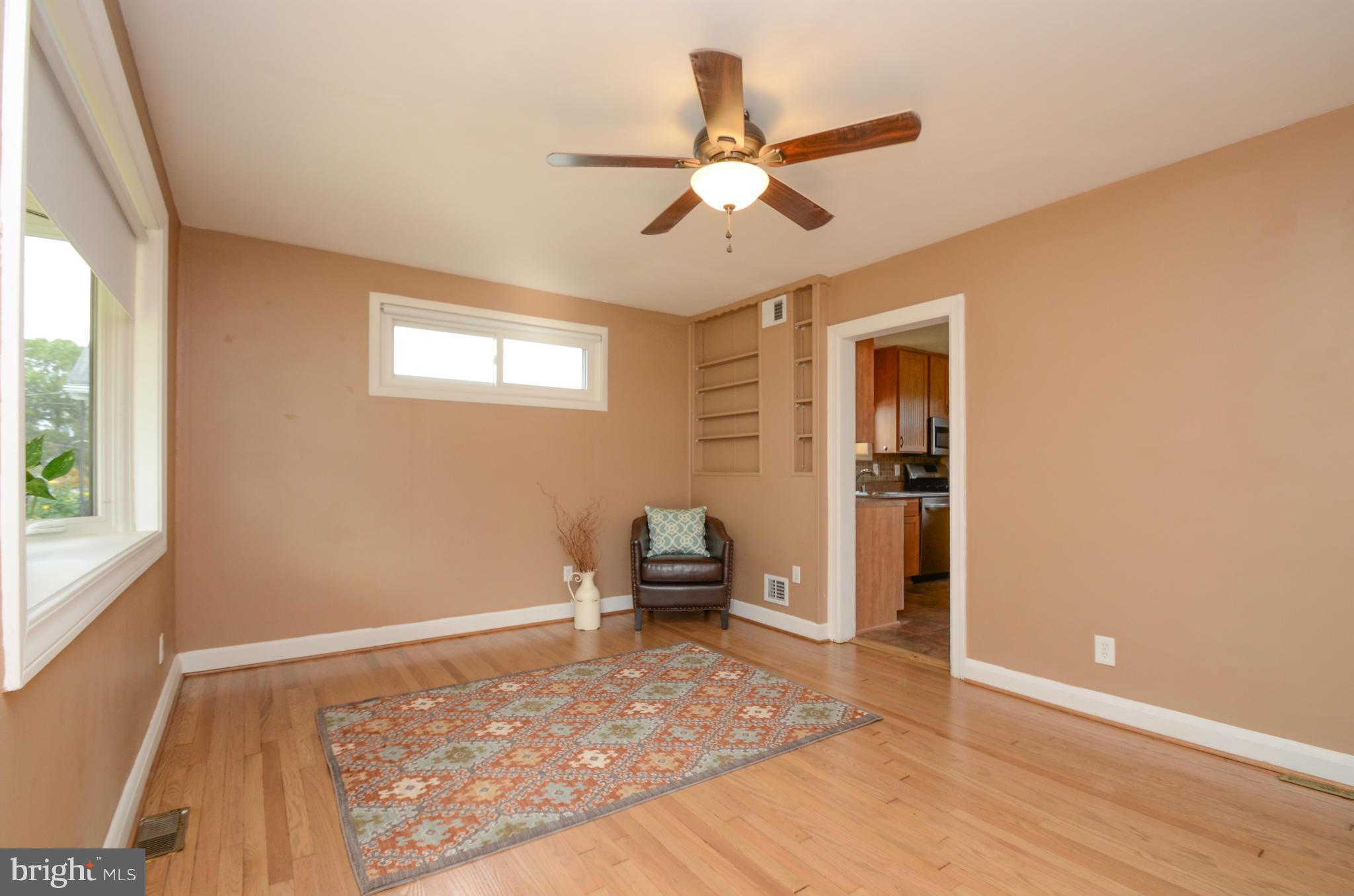 8107 Hillendale Road Baltimore, MD 21234 - Photo 2 of 30 wooden floor in an empty room with a window