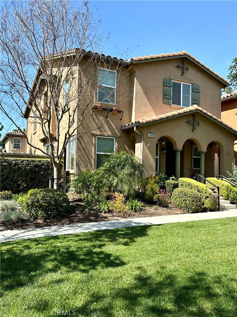 14448 Runyon Drive Eastvale, CA 92880 - Photo 1 of 1 a front view of a house with a yard