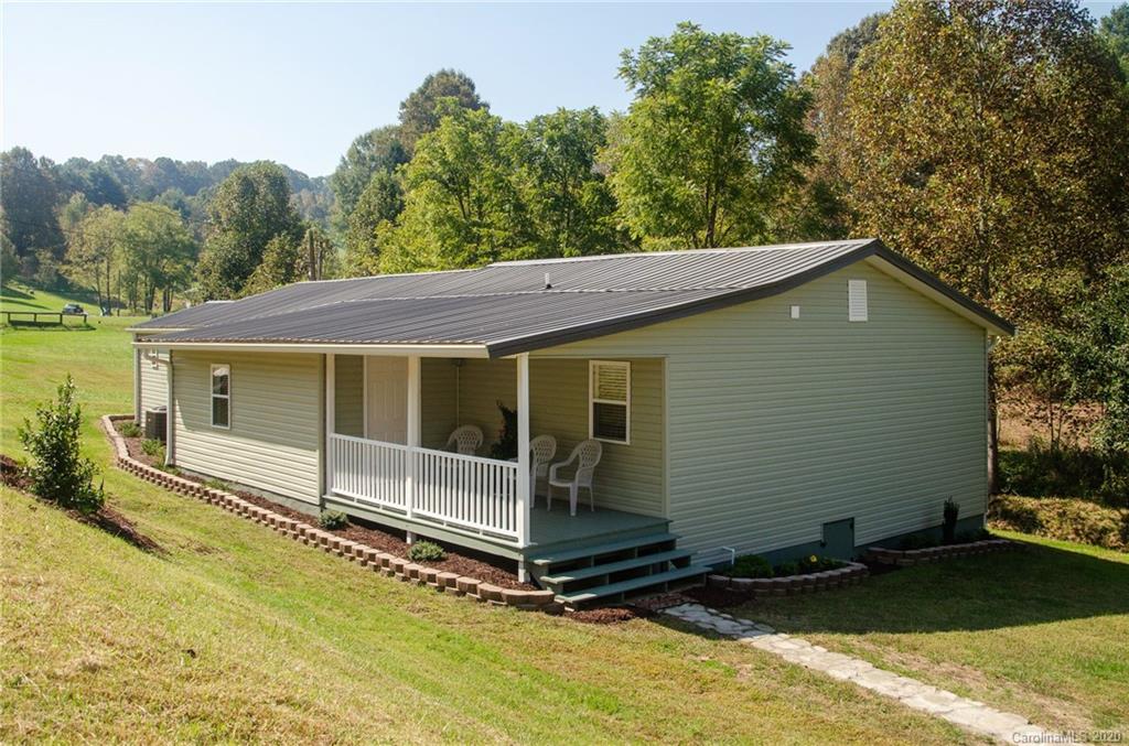 71 Jones Road Leicester, NC 28748 - Photo 1 of 20 a view of a small house with a yard