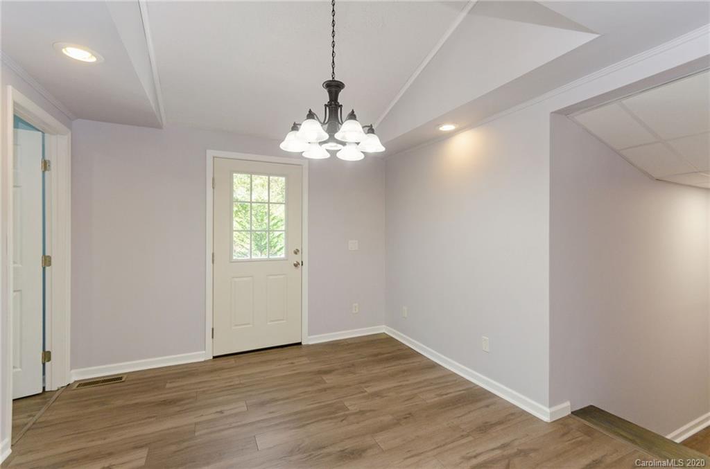 71 Jones Road Leicester, NC 28748 - Photo 13 of 20 a view of an empty room with window and wooden floor