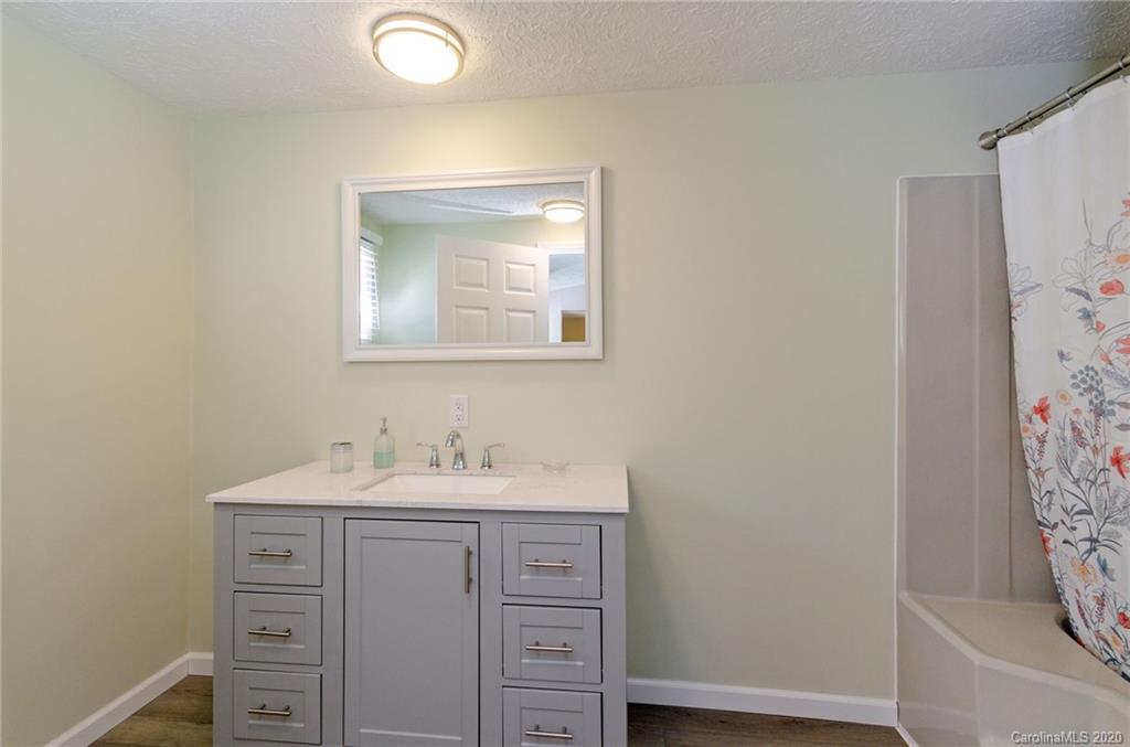 71 Jones Road Leicester, NC 28748 - Photo 15 of 20 a bathroom with a sink and a mirror