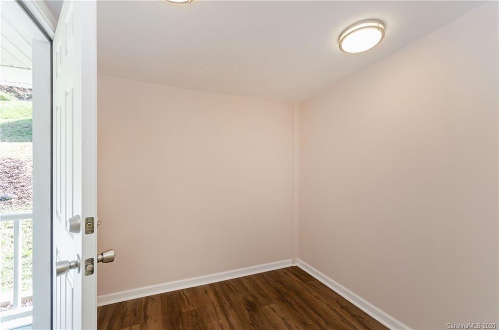 71 Jones Road Leicester, NC 28748 - Photo 6 of 20 a view of a room with wooden floor and fan