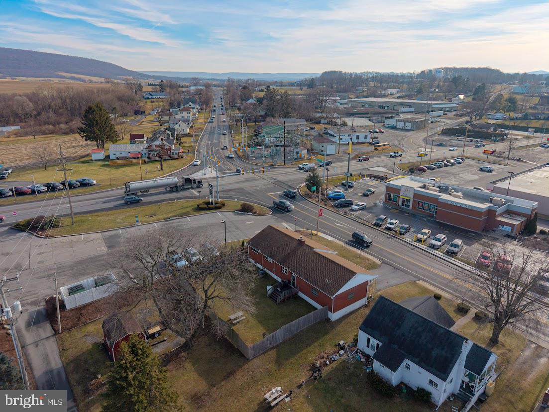 909 East Main Street Roaring Spring, PA 16673 - Photo 36 of 41 an aerial view of a city with lots of residential buildings and mountain view in back