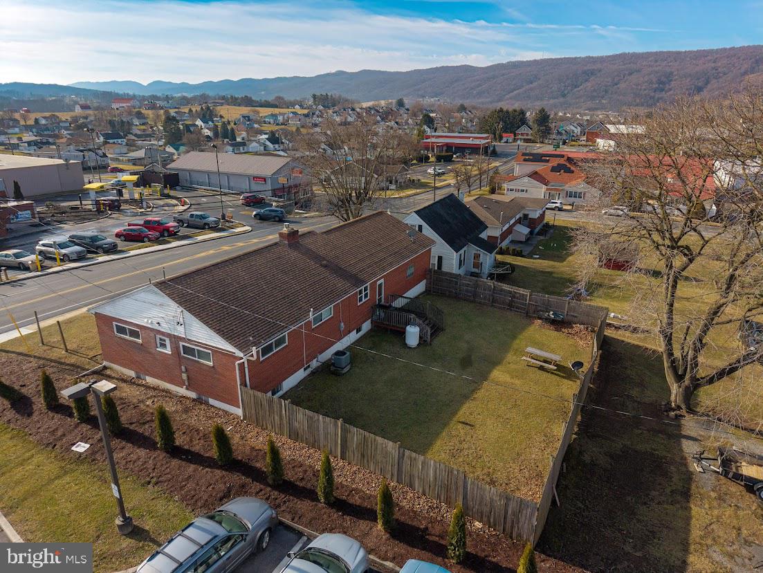 909 East Main Street Roaring Spring, PA 16673 - Photo 6 of 41 an aerial view of a house with a mountain