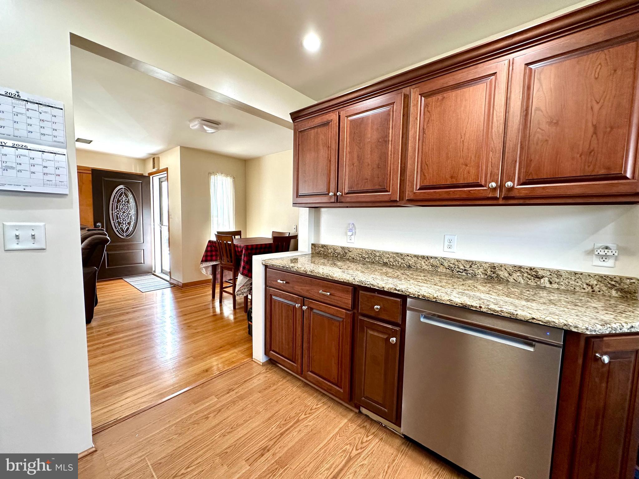 909 East Main Street Roaring Spring, PA 16673 - Photo 8 of 41 a kitchen with stainless steel appliances granite countertop wooden cabinets a sink and dishwasher