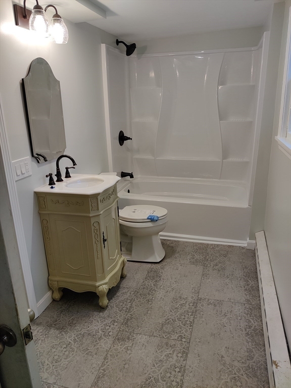 14 Elizabeth Street Dudley, MA 01571 - Photo 17 of 37 a bathroom with a sink a toilet and bathtub