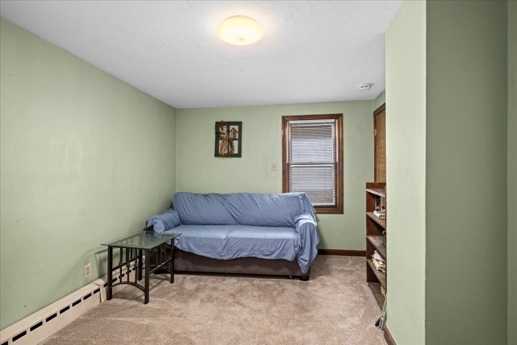 14 Elizabeth Street Dudley, MA 01571 - Photo 23 of 37 a living room with furniture and a window