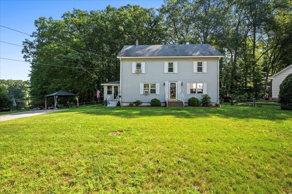 14 Elizabeth Street Dudley, MA 01571 - Photo 3 of 37 a front view of a house with a yard and trees